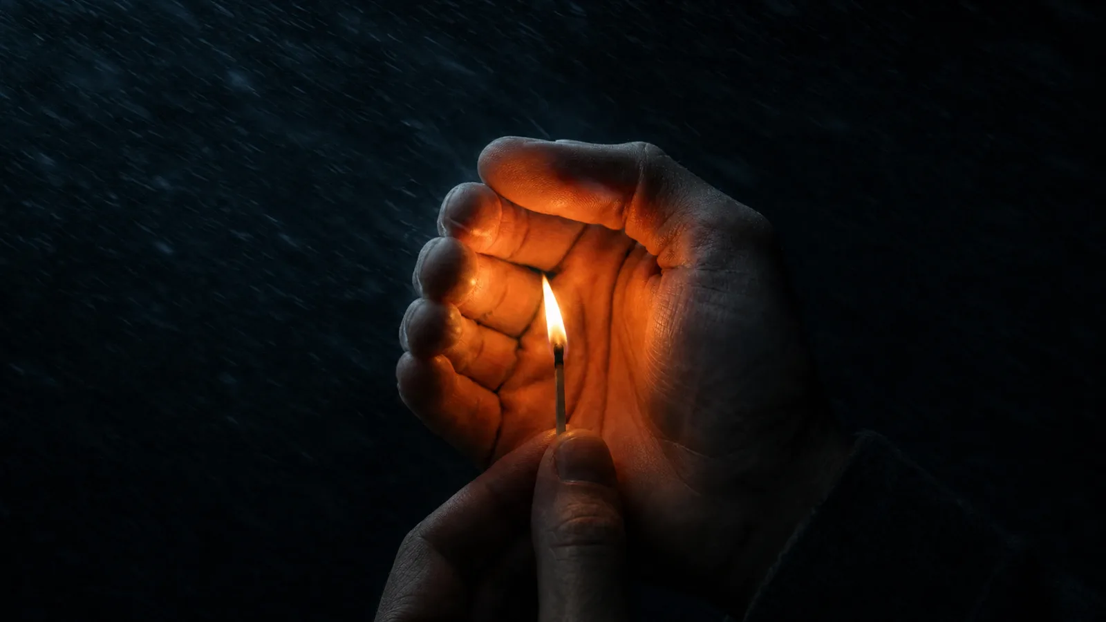 A cupped hand shields a small lit match against dark, driving rain. It is like protecting the customer while you triage.